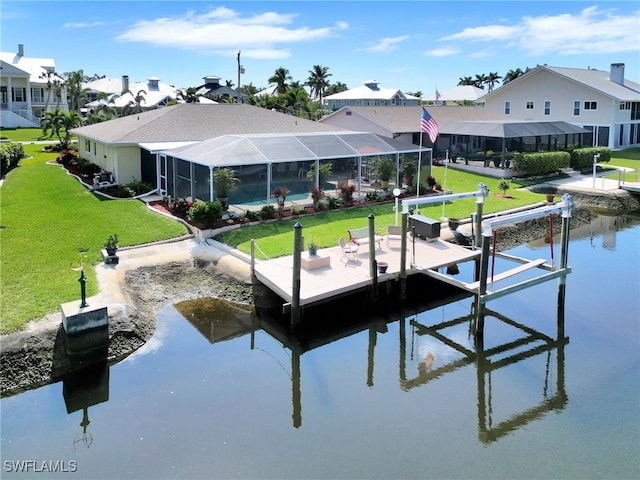 view of dock with a water view, a yard, and glass enclosure