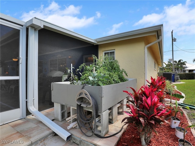 view of home's exterior with cooling unit