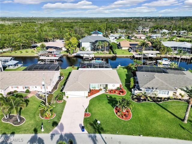 birds eye view of property with a residential view and a water view