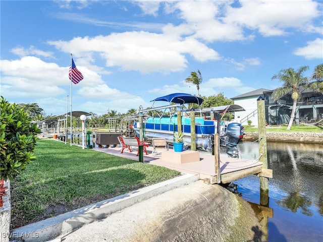 view of dock with a patio, a water view, a hot tub, and a lawn