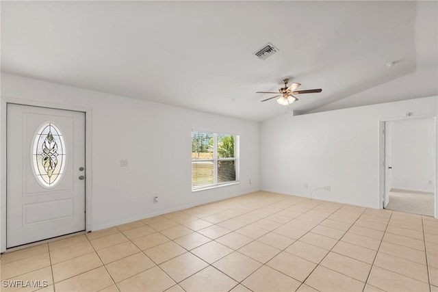 entryway featuring light tile patterned floors, vaulted ceiling, and ceiling fan