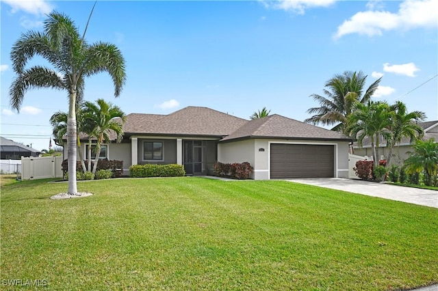 single story home featuring a garage and a front yard