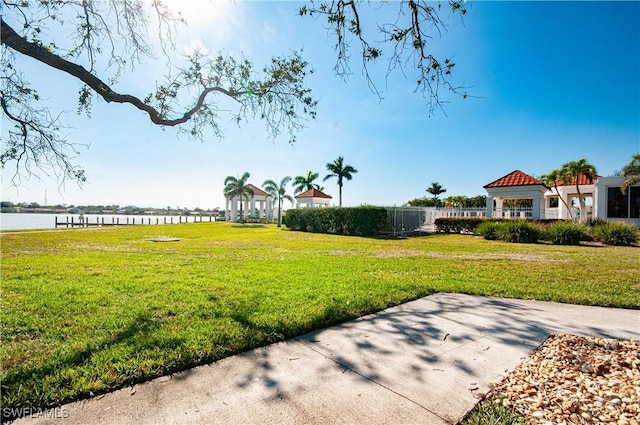 view of yard featuring a gazebo and a water view