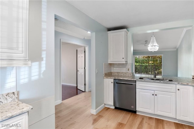 kitchen featuring sink, light wood-type flooring, black dishwasher, light stone countertops, and white cabinets