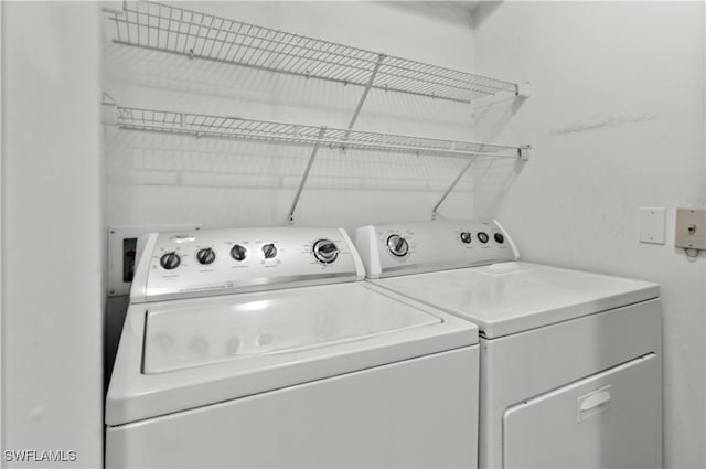 laundry room with washing machine and dryer