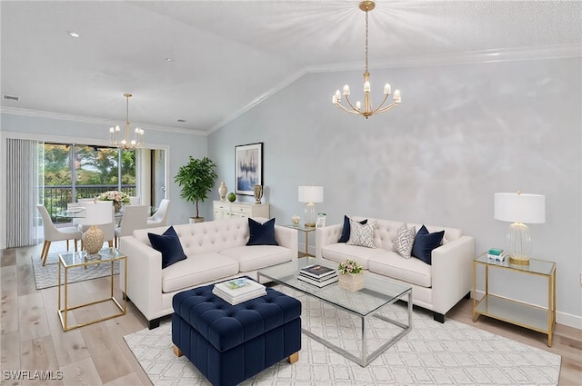 living room with an inviting chandelier, ornamental molding, light hardwood / wood-style flooring, and lofted ceiling