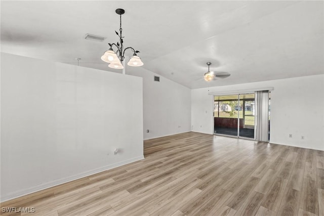 unfurnished living room featuring ceiling fan with notable chandelier, lofted ceiling, and light hardwood / wood-style floors