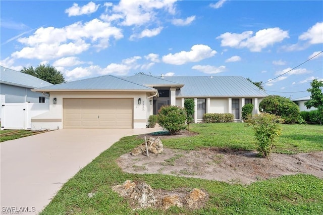 ranch-style home featuring a garage and a front lawn