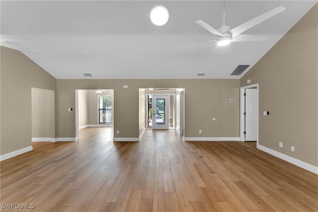 empty room with ceiling fan, lofted ceiling, and light wood-type flooring