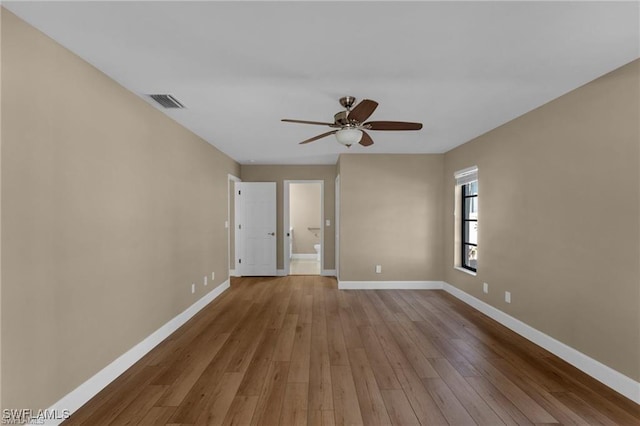 spare room featuring ceiling fan and light hardwood / wood-style floors