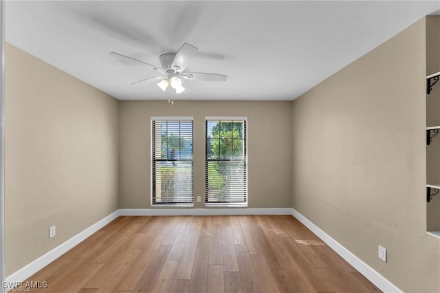 empty room featuring light hardwood / wood-style floors and ceiling fan