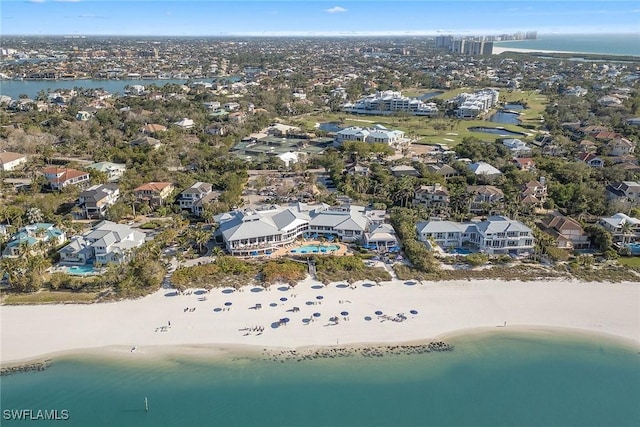 bird's eye view featuring a water view and a view of the beach