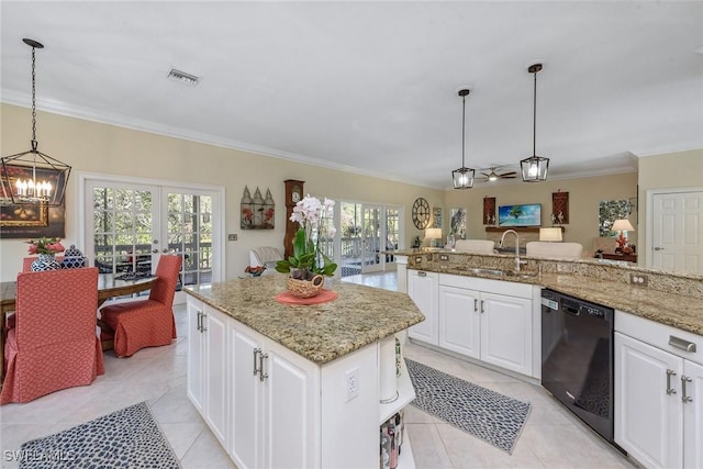 kitchen with sink, white cabinetry, decorative light fixtures, dishwasher, and a kitchen island