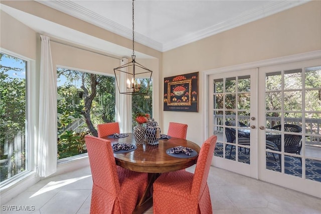 tiled dining space with french doors, ornamental molding, and a wealth of natural light