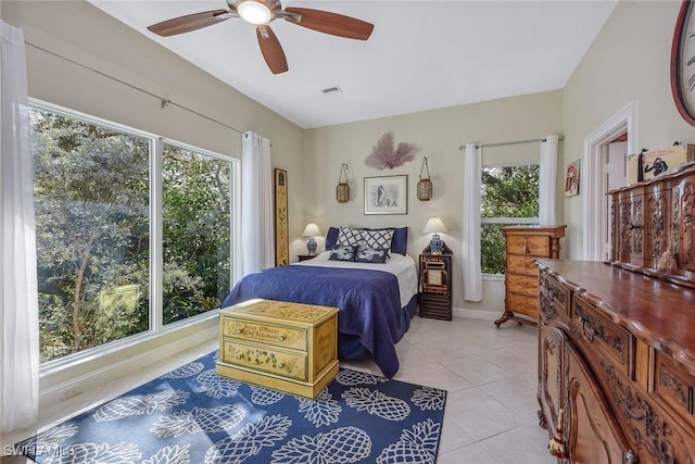 bedroom featuring ceiling fan and light tile patterned floors