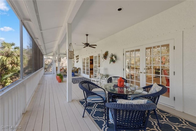 deck with french doors and ceiling fan