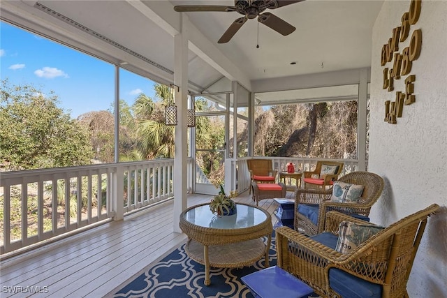 sunroom / solarium with a wealth of natural light and ceiling fan