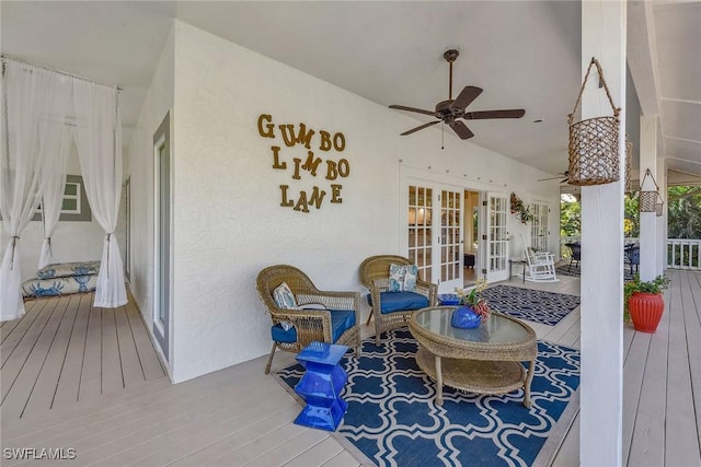 deck featuring ceiling fan and french doors