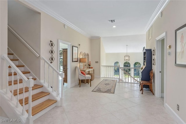 tiled entrance foyer with crown molding