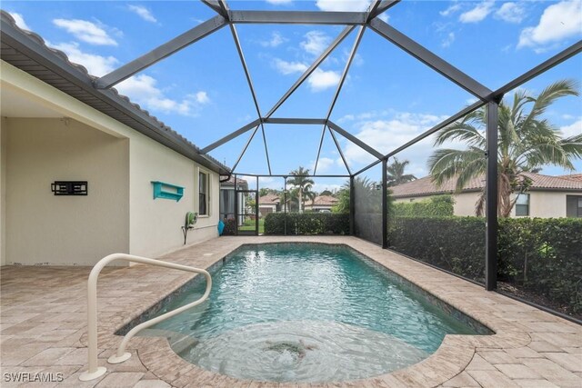 outdoor pool with a lanai and a patio