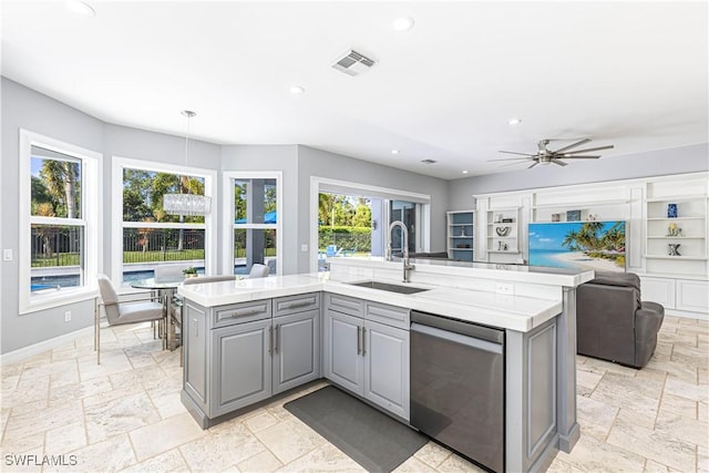 1801 Senegal Date Dr, Naples, FL 34119 - kitchen featuring a sink, dishwasher, gray cabinets, open floor plan, and light countertops