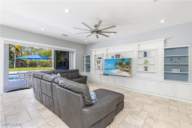 1801 Senegal Date Dr, Naples, FL 34119 - living area featuring stone tile floors, recessed lighting, and ceiling fan