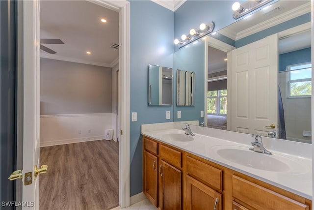 1801 Senegal Date Dr, Naples, FL 34119 - ensuite bathroom featuring plenty of natural light, wood finished floors, ornamental molding, double vanity, and ceiling fan