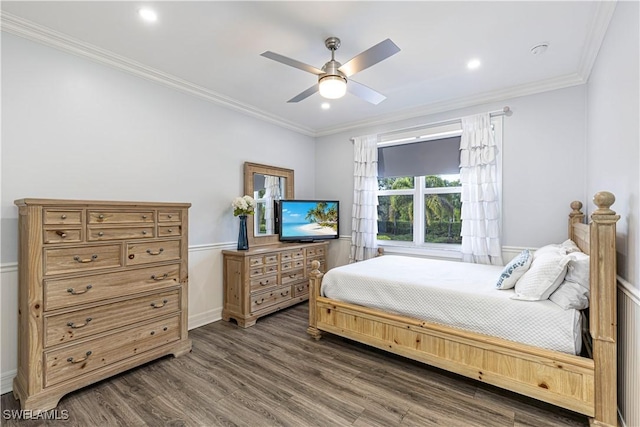 bedroom featuring dark wood-type flooring, ceiling fan, and crown molding