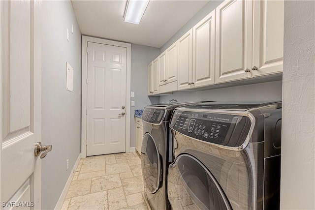1801 Senegal Date Dr, Naples, FL 34119 - laundry room with independent washer and dryer, cabinet space, baseboards, and stone tile flooring