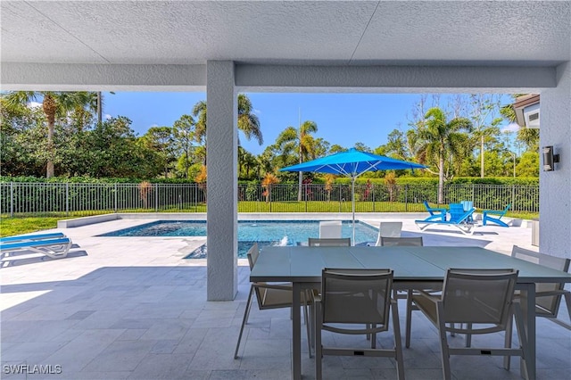 1801 Senegal Date Dr, Naples, FL 34119 - view of swimming pool with a patio area, a fenced backyard, and outdoor dining area