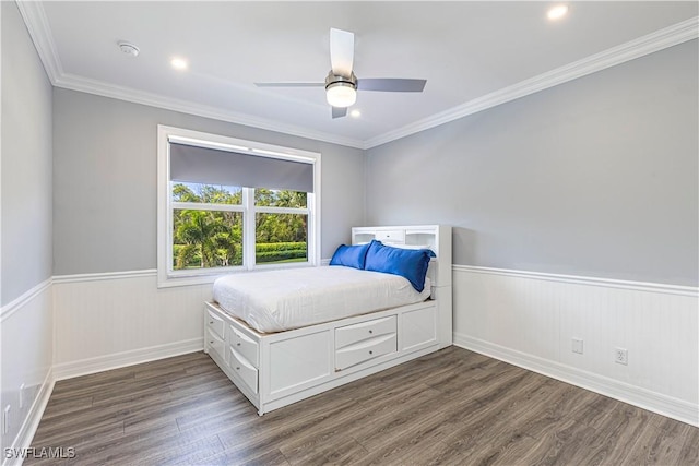 bedroom featuring ornamental molding, ceiling fan, and dark hardwood / wood-style flooring