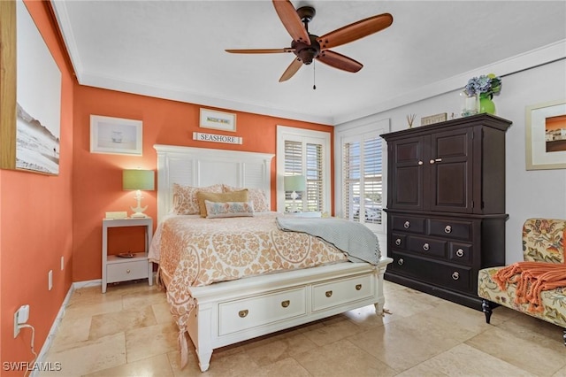 bedroom featuring a ceiling fan and baseboards