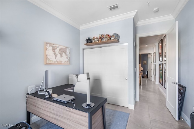 office area with ornamental molding and light tile patterned floors