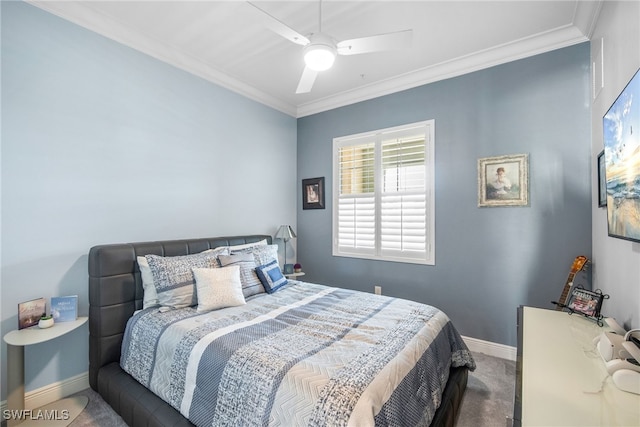 carpeted bedroom with ceiling fan and ornamental molding