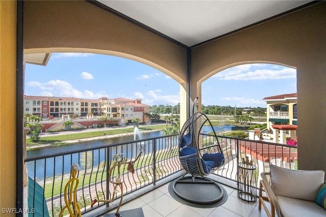 balcony featuring a water view