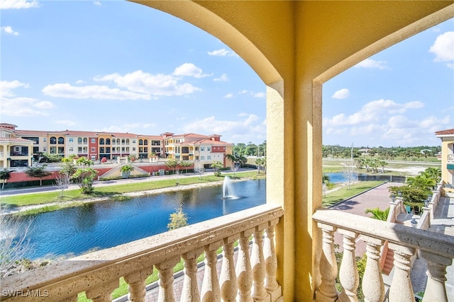 balcony featuring a water view