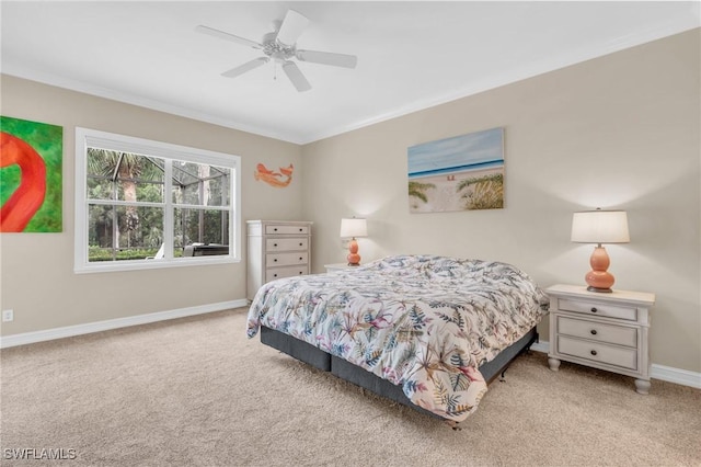 bedroom with ceiling fan, light colored carpet, and ornamental molding