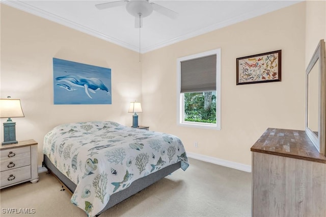 carpeted bedroom featuring crown molding and ceiling fan