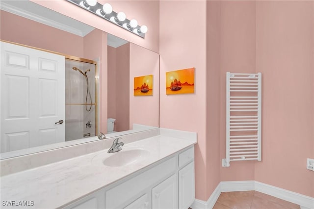 12560 Wildcat Cove Cir, Estero, FL 33928 - bathroom featuring radiator heating unit, a shower with shower door, toilet, tile patterned flooring, and vanity
