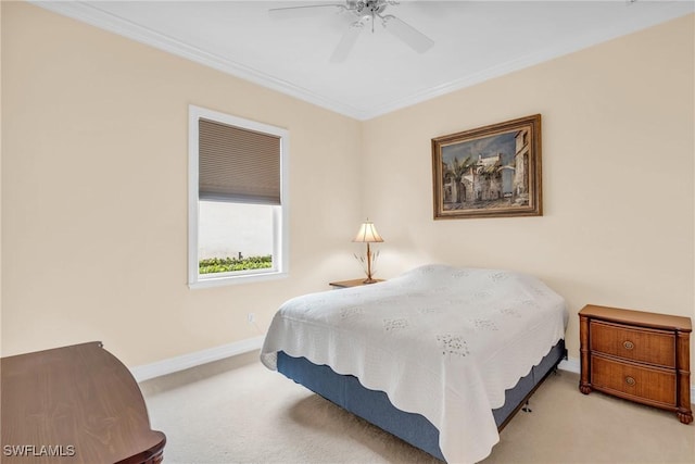 bedroom with ornamental molding, light colored carpet, and ceiling fan