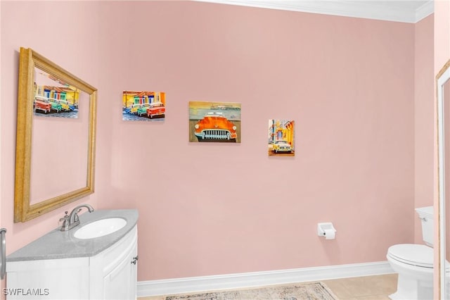 12560 Wildcat Cove Cir, Estero, FL 33928 - bathroom featuring vanity, toilet, baseboards, ornamental molding, and tile patterned floors