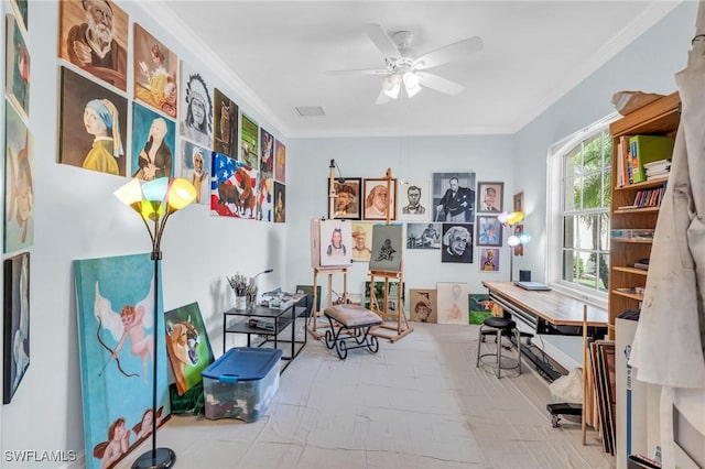 interior space with ornamental molding and ceiling fan