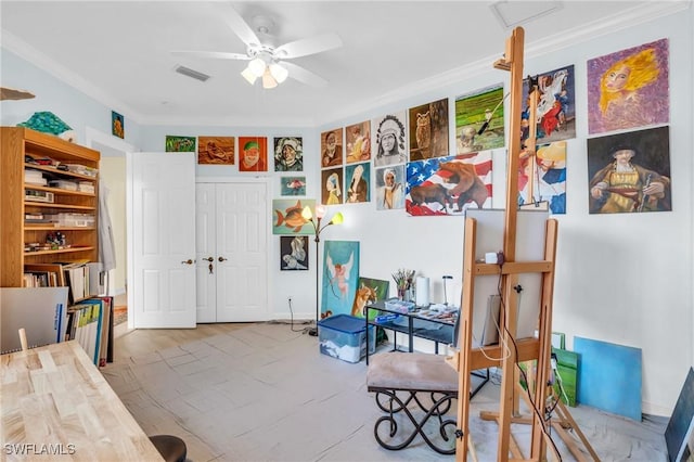 rec room with crown molding and ceiling fan