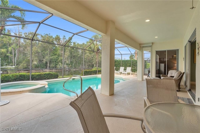 view of swimming pool with an outdoor living space, a patio, glass enclosure, and an in ground hot tub