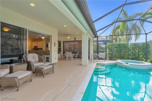 view of swimming pool with an in ground hot tub, glass enclosure, and a patio