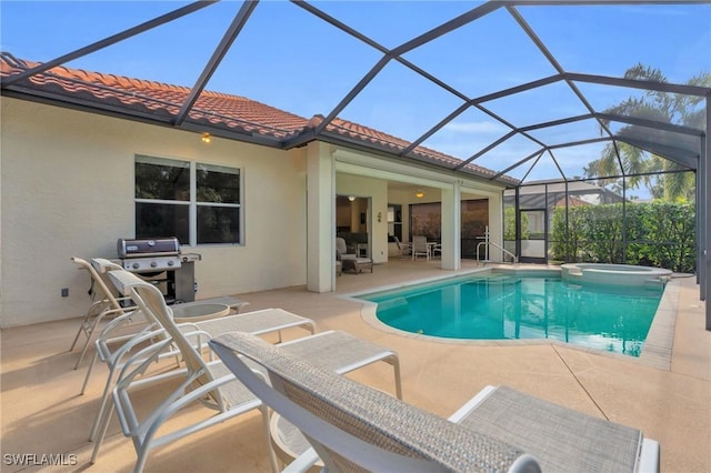 view of swimming pool with an in ground hot tub, grilling area, a lanai, and a patio