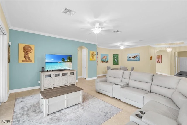 living room with crown molding, ceiling fan, and light tile patterned floors