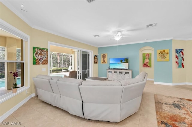 tiled living room featuring crown molding