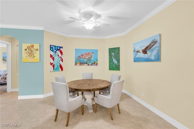 dining space with ornamental molding, ceiling fan, and light tile patterned flooring