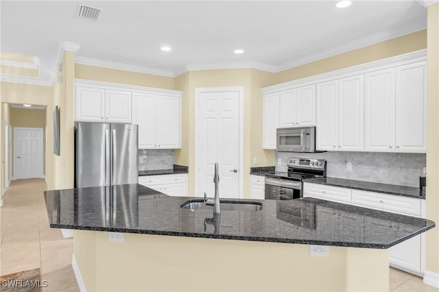 12560 Wildcat Cove Cir, Estero, FL 33928 - kitchen with stainless steel appliances, a sink, light tile patterned floors, white cabinetry, and crown molding